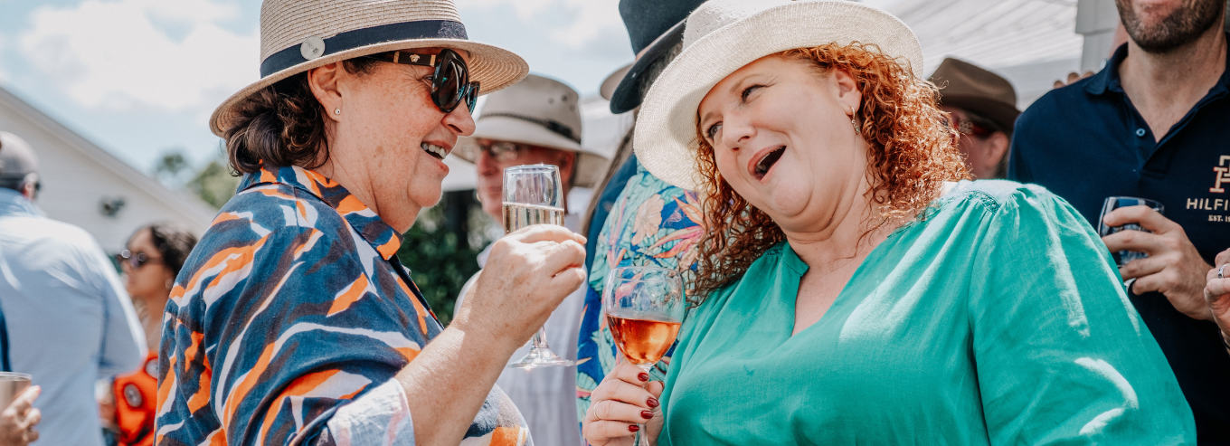 People enjoying Molly Morgan Vineyard wines at an event 